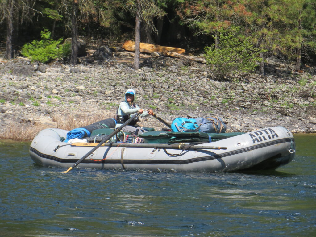 rower floating with oars turned sideways